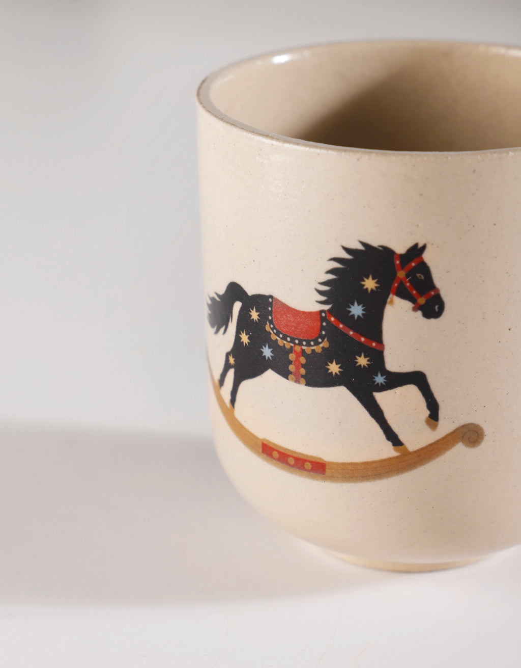 Handmade Black Rocking Horse with Cream & Blue Stars Ceramic Stoneware Handleless Cup